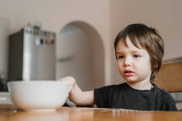 istock A little boy doesn't want to eat his breakfast 1313497221