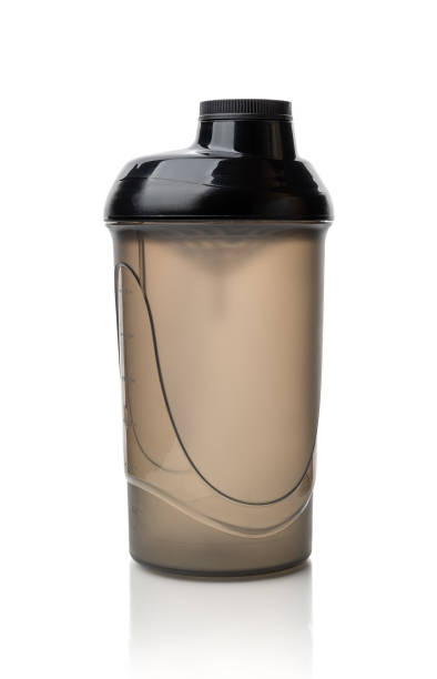 istock Protein shaker bottle isolated on white background. Translucent plastic container for mixing protein drinks. Empty closed lid shaker for sport food cocktail design template. 1313500939