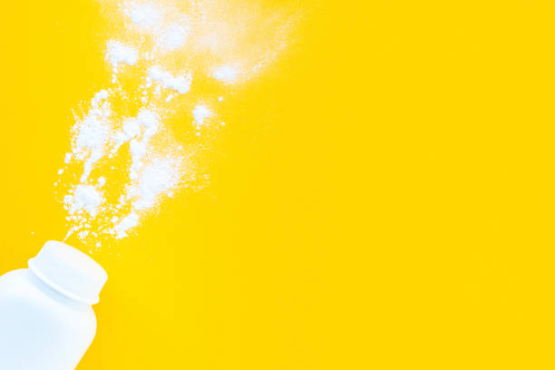 istock White baby powder jar on yellow background, flat layout, top view, copy space, mockup. Minimalist concept of baby hygiene 1313503144