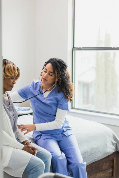 istock Nurse listens to elderly patient's lungs 1313504629