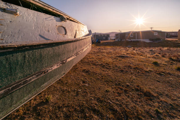 An old wooden boat in Inuit community of Qikiqtarjuaq, Broughton Island, Nunavut, Canada. Settlement in the far north. Arctic community. stock photo