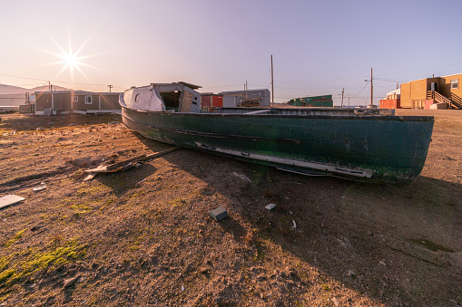 An old wooden boat in Inuit community of Qikiqtarjuaq, Broughton Island, Nunavut, Canada. Settlement in the far north. Arctic community. The north.
