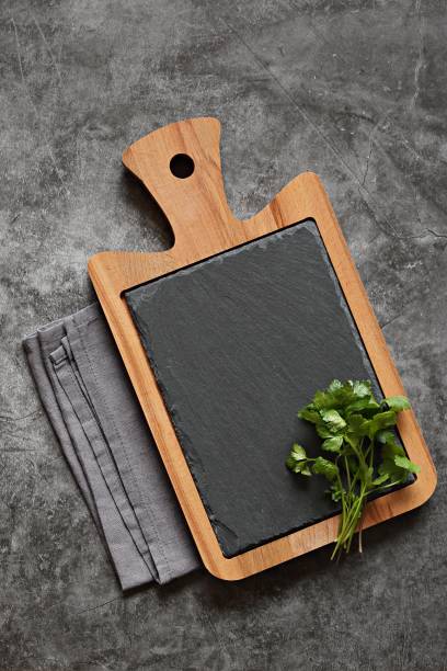 istock Dark grey cooking background with cutting board. 1313512166