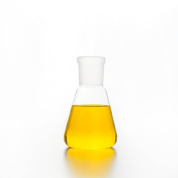 istock Chemistry flask with transparent yellow liquid for science research and experiment. 1313512924