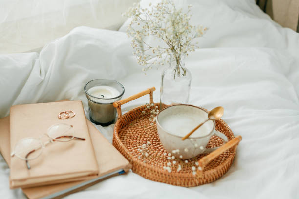 istock Breakfast in bed, cappuccino, wicker tray, spring, home decor. Cozy. 1313515281