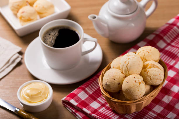 cheese breads and coffee. cheese bread, traditional brazilian snack. - cooked bread food cup imagens e fotografias de stock