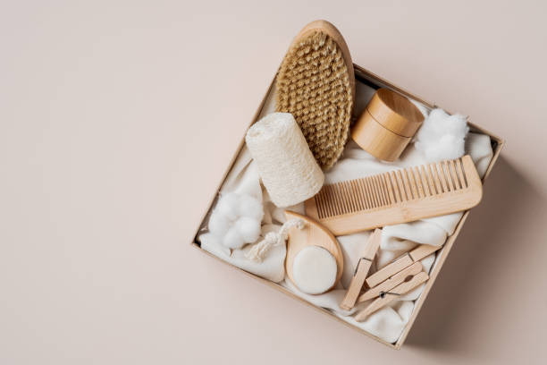 istock Beauty box with self care cosmetics and SPA accessories. Flat lay, top view present box with wooden hair comb, body brush, loofah, moisturizer cream. 1313515647