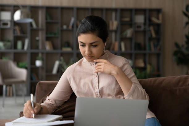 istock Focused millennial Indian woman study online using laptop 1313516006