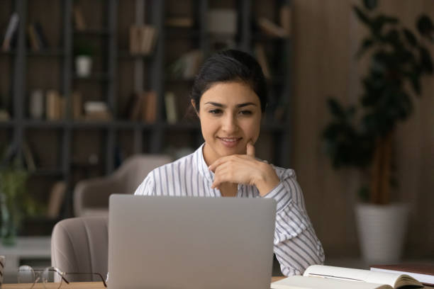 istock Indian woman work online on computer gadget 1313516044