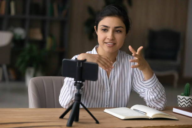 istock Indian woman record vlog on smartphone camera 1313516111