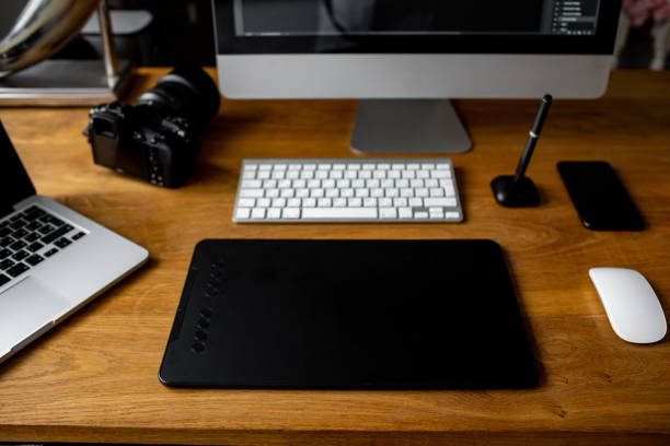 istock Creative professional designer's desk from above. Designer workspace top view with essential elements on wooden table. 1313516112