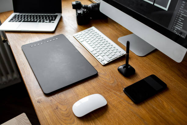 istock Creative professional designer's desk from above. Designer workspace top view with essential elements on wooden table. 1313516205