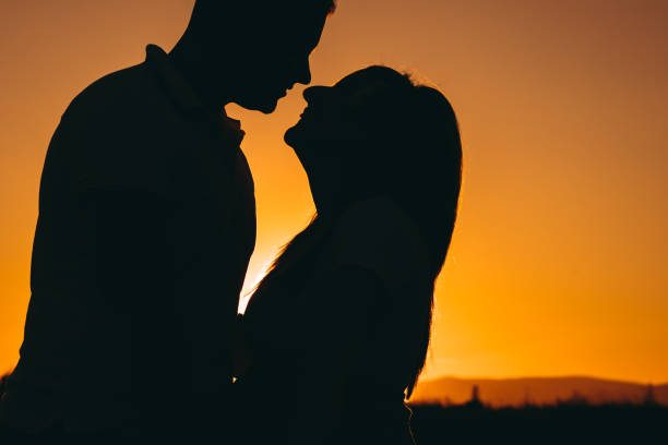 istock Couple kissing at sunset 1313517018