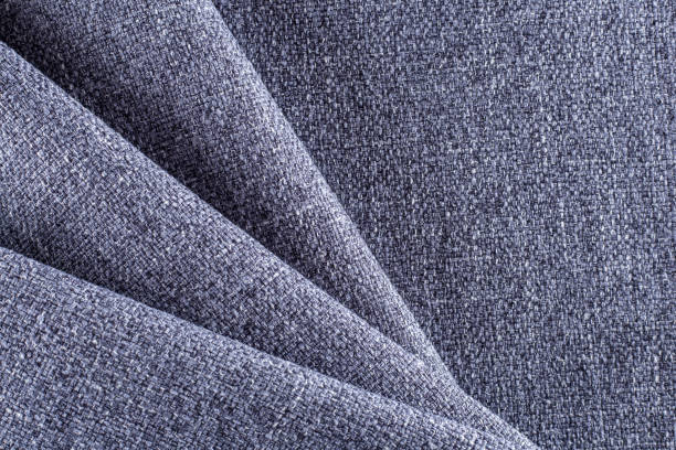istock dense upholstery fabric in lavender color with linen texture, pleated drapery 1313517319