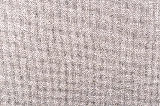 istock smooth surface of dense cream-colored upholstery fabric with linen texture, background 1313517350