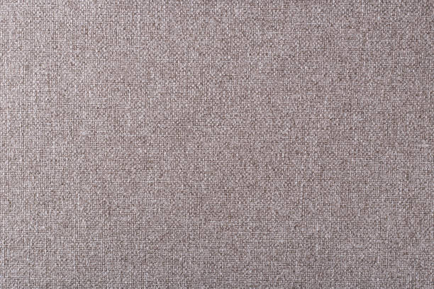 istock smooth surface of light brown dense upholstery fabric with linen texture, background 1313517352