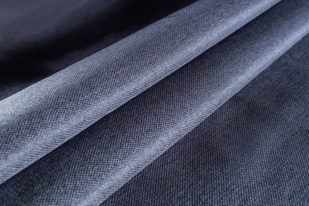 istock dense upholstery fabric in dark blue, pleated drapery 1313517370