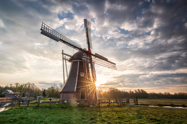istock beautiful sunrise behind Dutch windmill, Groningen 1313518043