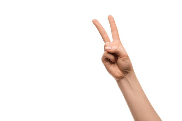 istock A woman's hand shows two fingers on a white background 1313518697