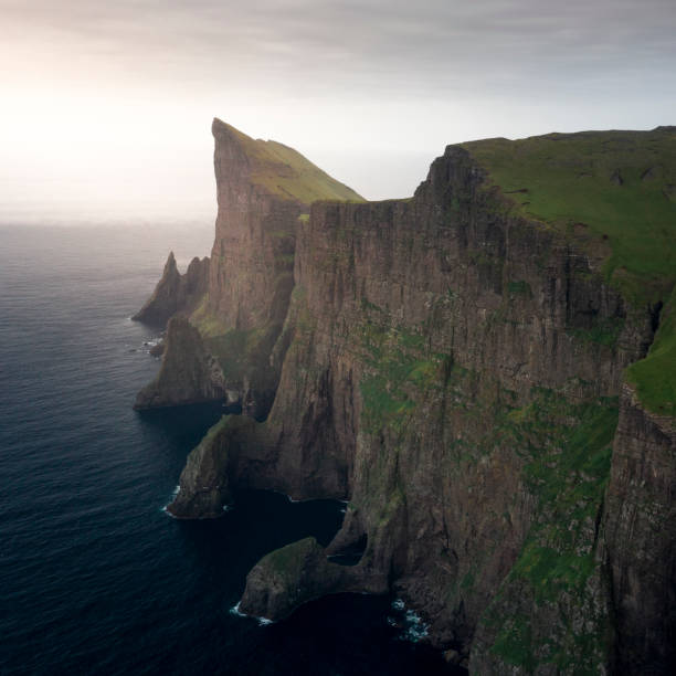istock Steep cliffs at Mylingur on island Streymoy, Faroe Islands 1313519418