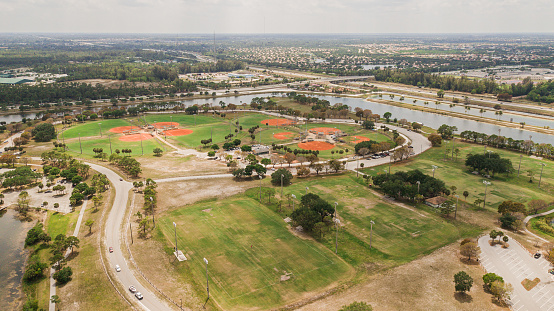 Aerial View of a Blue Sky Over Lush Green and Orange Baseball Fields at a Park in Central West Palm Beach, Florida During COVID-19 in April of 2021