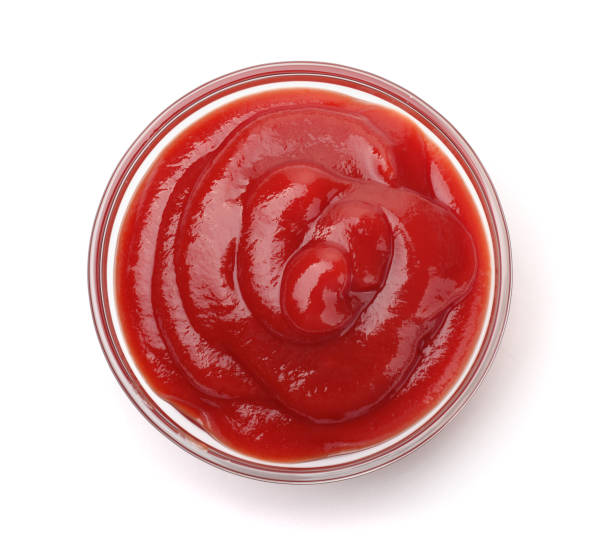 Bowl of  tomato sauce Bowl of  tomato sauce isolated on white ketchup stock pictures, royalty-free photos & images