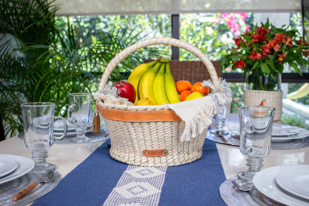 Baskets made of woven palm leaves served on the table with fresh fruit, ready to start eating. traditional and handmade product from latin america and mexico.