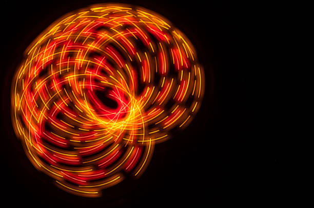 istock Abstract: Colorful Swirls of Light Creating Butterfly Pattern on a Black Background 1313522472