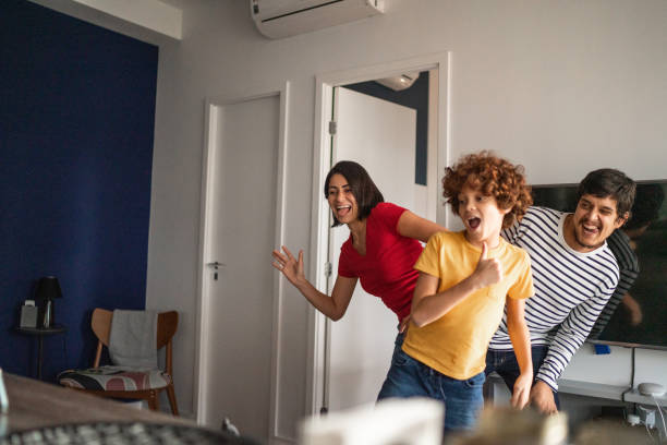 family dancing together at home - parent mother music listening imagens e fotografias de stock