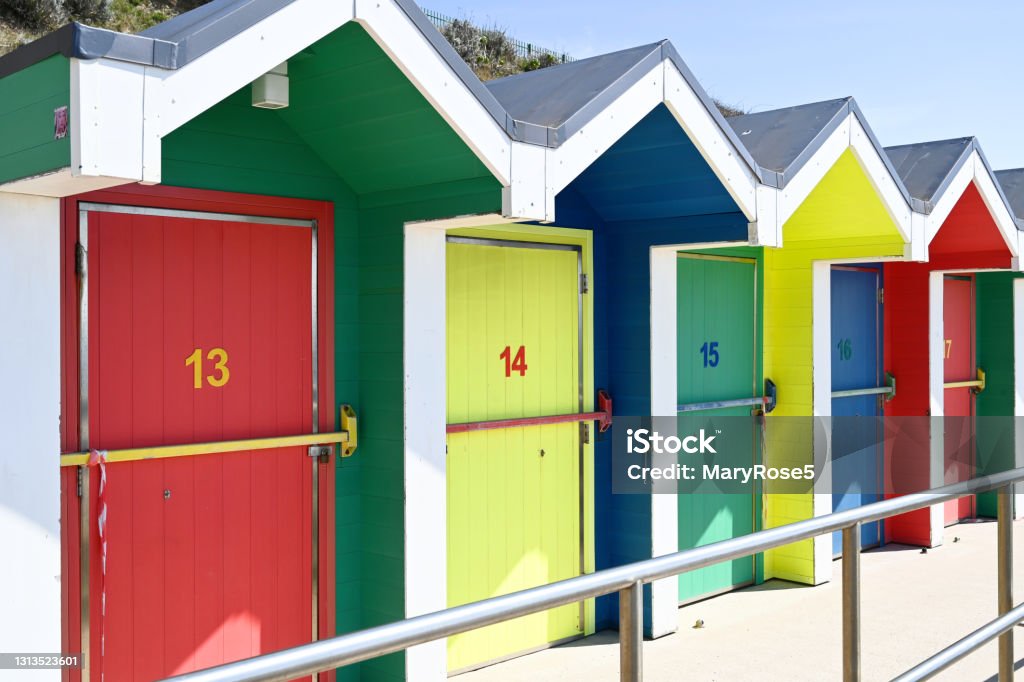 Colorful huts at the beach A row of colorful beach huts at Barry Island, Wales, UK Beach Stock Photo