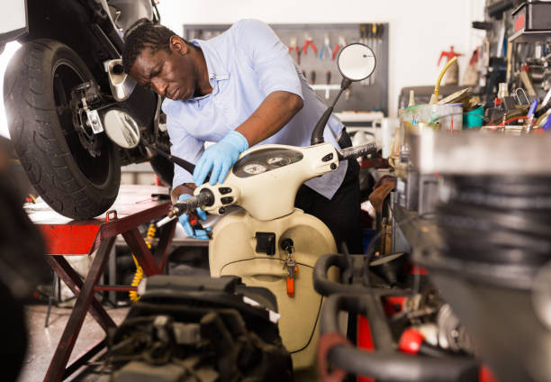 istock Confident man worker repairing motorcycle in workshop 1313523856