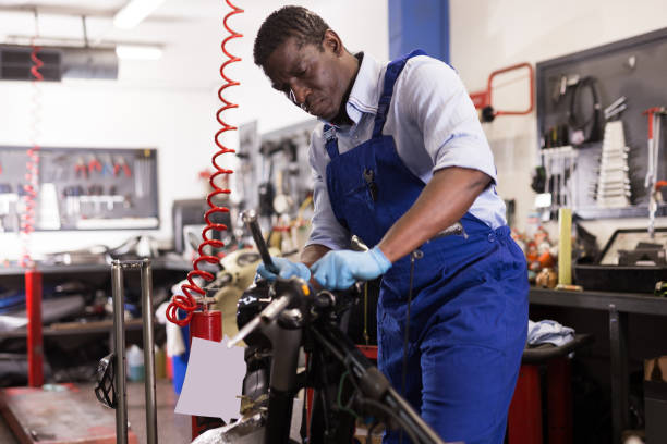 istock Service engineer repairing motorcycle in motorcycle service 1313523918