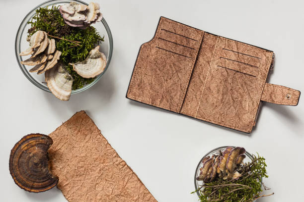 istock Vegan leather wallet made from mushroom mycelium, vegan bio leather samples top view, eco friendly concept 1313524826