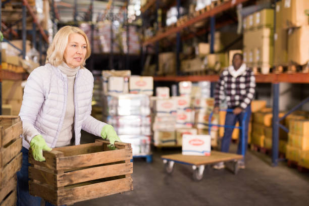 istock Tired woman carrying boxes 1313524981