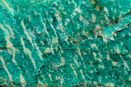 Abstract background. Rough surface of natural green amazonite