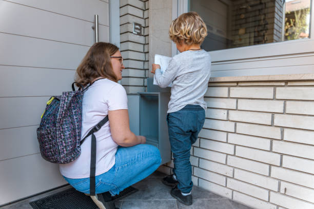 istock Caucasian Mother and Son Checking Mailbox Together 1313527697