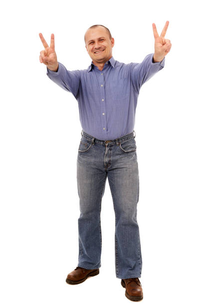 istock Businessman showing victory sign, isolated on white 1313527937