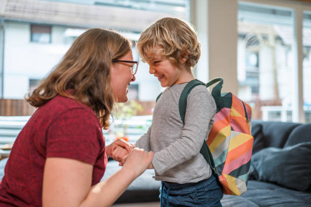 istock Caucasian Mother Helping Her Son Get Ready For School 1313530257