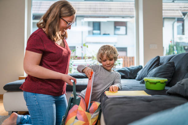 istock Caucasian Mother Helping Her Son Get Ready For School 1313530269