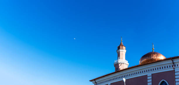 Mosque on blue sky background. Muslim worship.