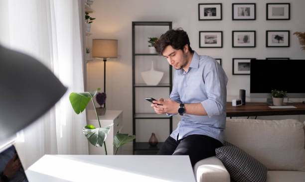 istock Young man using social media at home 1313532819