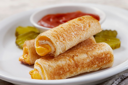 Grilled Cheese Roll Up Sandwiches with Ketchup and Pickles