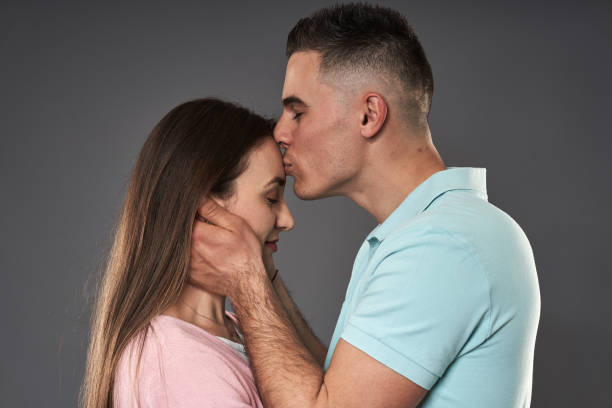 istock Young couple studio shot on gray 1313533690