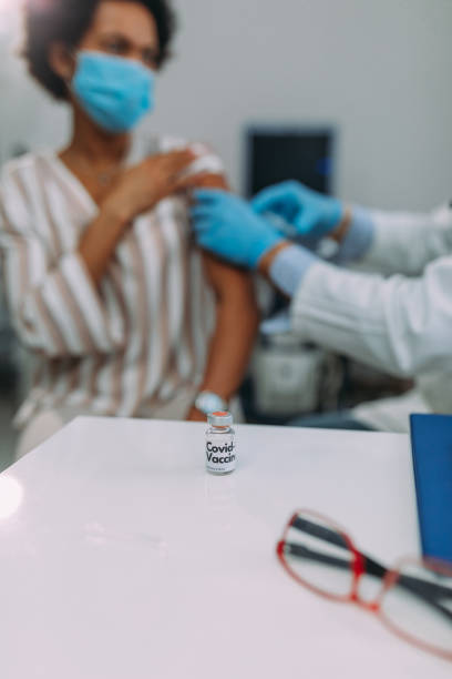 istock Doctor applying vaccine on patient's arm 1313533996