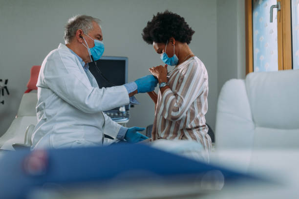 istock Doctor listening to patient's lungs with stethoscope 1313534002
