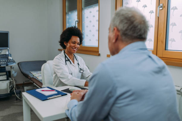 istock Female doctor examining a senior patient 1313534010