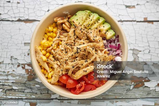 Aerial View Of An Avocado Chicken Poke And Cherry Tomatoes Stock Photo - Download Image Now