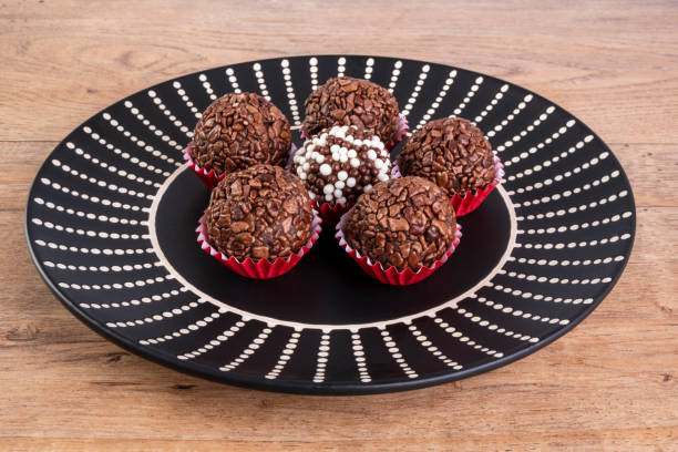 istock brigadiers in black dish on wooden table 1313536097