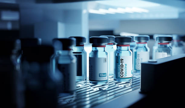 Production of Covid-19 Vaccine Vials In Cold Storage Bottle vials of Covid-19 vaccine production in cold refrigerated storage. Pharmaceutical 3D illustration. preventative medicine stock pictures, royalty-free photos & images