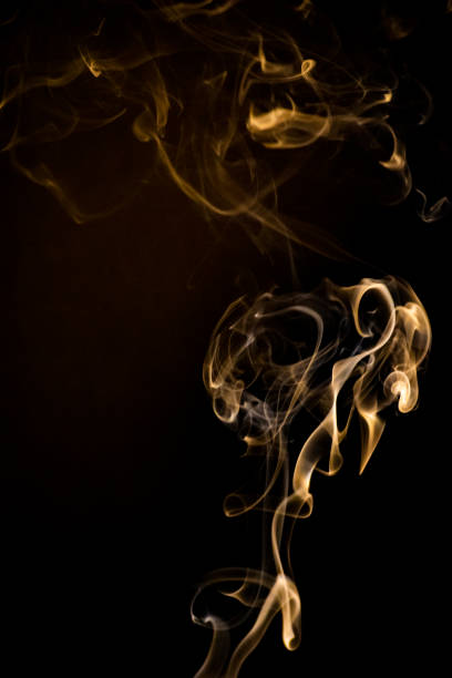 istock Golden Yellow smoke in swirling pattern 1313536135